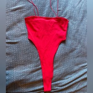 Red High-cut Camilla bodysuit from Edikted